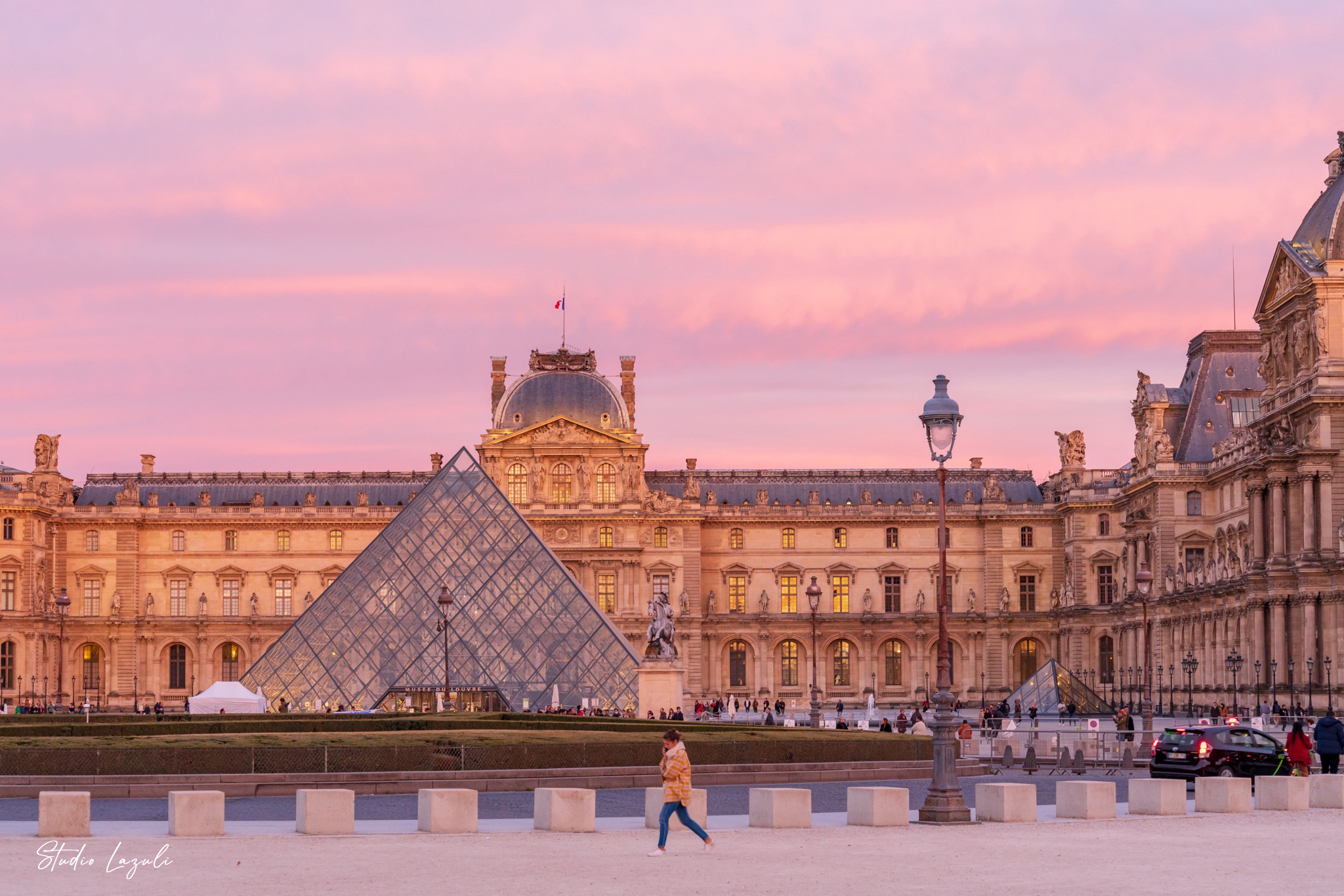 Visit the Louvre as the sky turns pink.